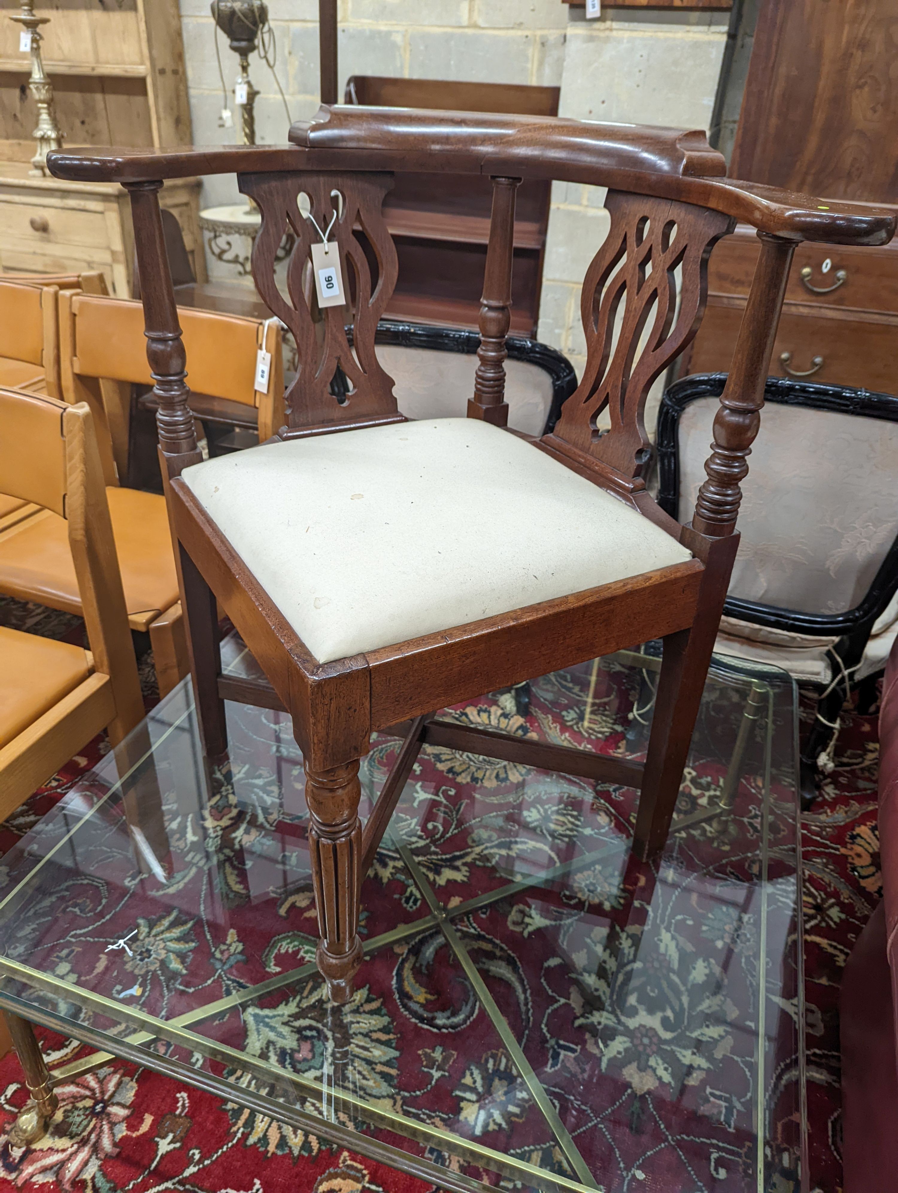 A George III mahogany corner elbow chair, width 76cm, depth 64cm, height 81cm